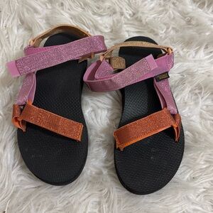 Pink, orange and nude colored Tevas